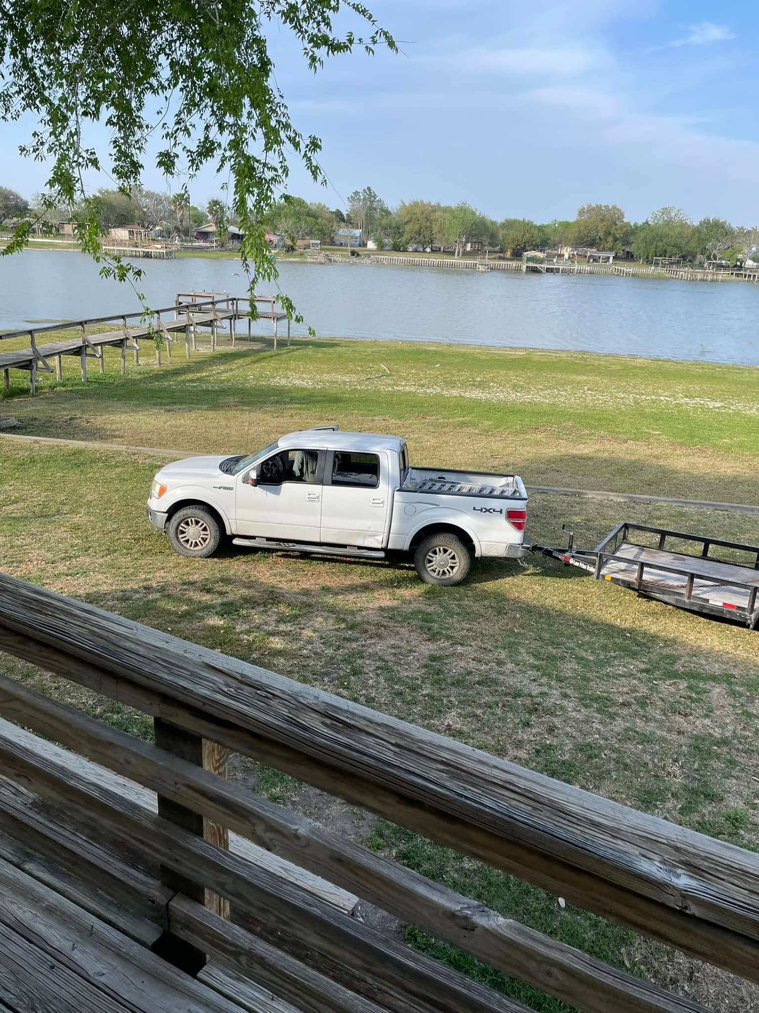 Truck towing a trailer near the water